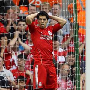 Liverpool's Suarez charged with violent conduct