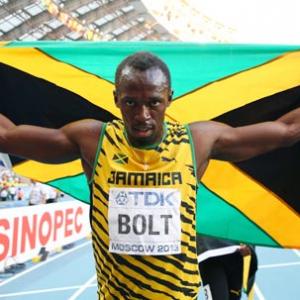 Bolt completes sprint double with ease at world athletics