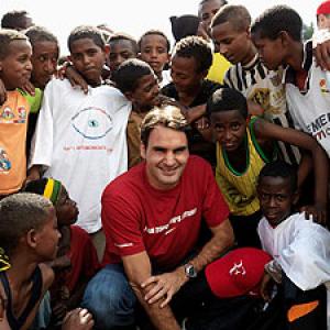 Federer plays big brother to village kids at charity event