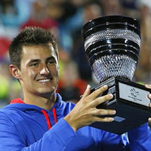 Tomic, Hewitt give locals hope; Ferrer equals record