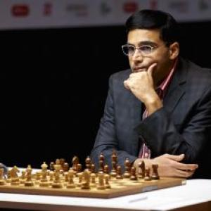 Anand crushes Topalov, moves to joint second