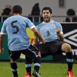 Qualifiers: Suarez brace boosts Uruguay's hopes; US suffer setback