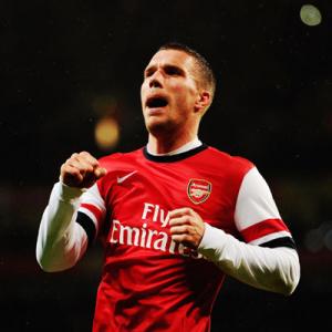 FA Cup: Podolski double helps Arsenal rout Coventry City