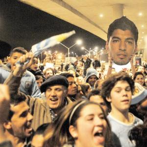 PHOTOS: Fans give banned Suarez hero's welcome
