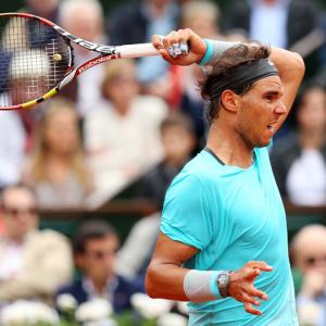French Open Photos: Nadal gains momentum, Ferrer eases through