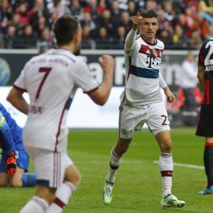 Mueller hat-trick sends Bayern seven points clear at the top