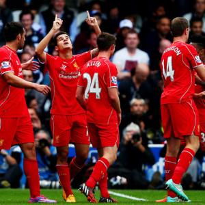 EPL PHOTOS: 'Lucky' Liverpool strike late to down QPR on dramatic weekend