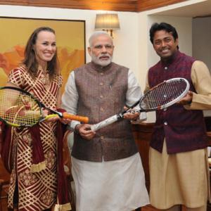 Paes, Hingis present PM Modi with autographed racquets