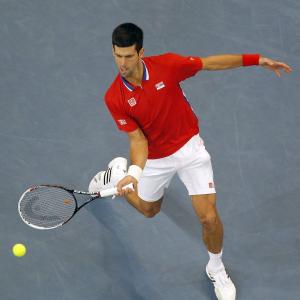 Serbia, France sail into Davis Cup last eight