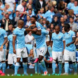 Man City flex muscles as English clubs break spending record