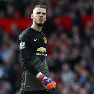 Soccer shots: De Gea signs new four-year United contract