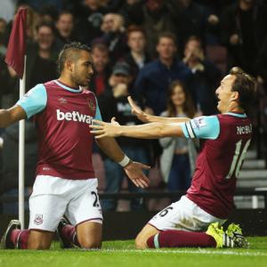 EPL PHOTOS: Hammer Payet's double sees Newcastle slide to bottom