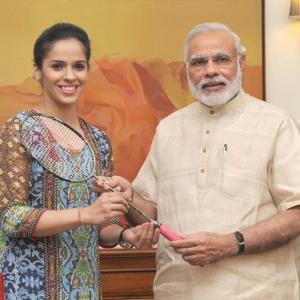 First Look: Saina presents her racquet to PM Modi