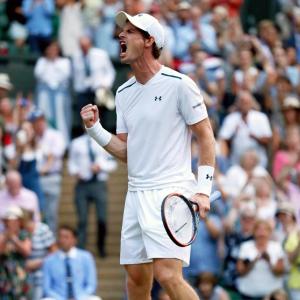 Murray overcomes brutal tussle to reach last 16