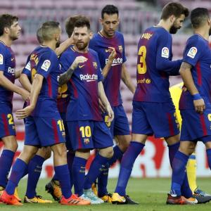 Messi strikes twice in empty Nou Camp