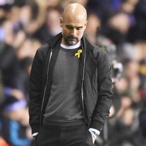 FA charges Guardiola for wearing Catalan support ribbon