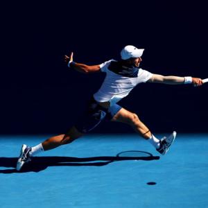 PHOTOS: Djokovic survives Melbourne furnace to beat Monfils