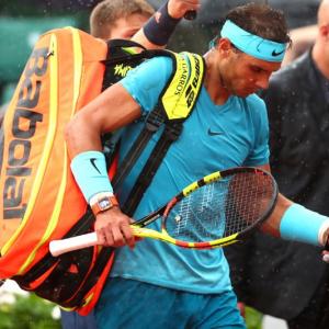 French Open: Nadal trails as rain suspends play
