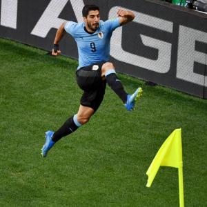 World Cup: Vintage Suarez on the spot as Uruguay go through