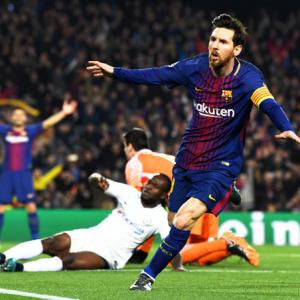 King Messi lights up Nou Camp with 100th Champions League goals