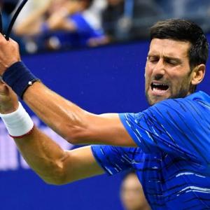 US Open PICS: Djokovic, Federer through; Venus exits