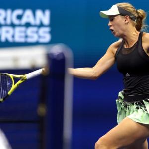 PIX: Wozniacki safely into third round; Halep shocked