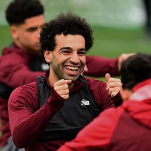 Liverpool's Salah feeling the heat in title chase
