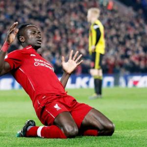 EPL PHOTOS: Liverpool, City march on as Spurs slip again