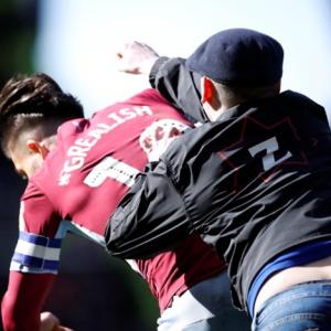 Aston Villa's Grealish is PUNCHED by pitch invader in derby win