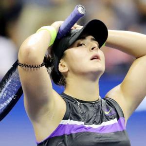 PICS: Andreescu sees off Mertens to make US Open semis