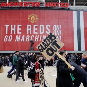 Man United-Liverpool tie postponed as fans storm pitch