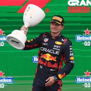 Record-equalling Verstappen bags rain-soaked win