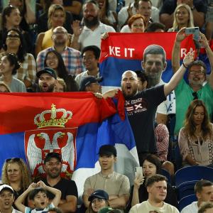 Djokovic's dad seen with fans carrying Russia flags