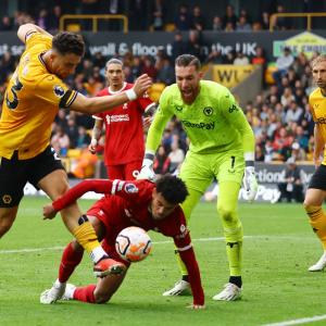EPL PIX: Liverpool go top win at Wolves