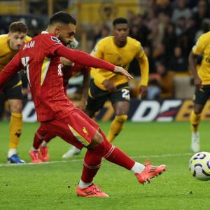 EPL PIX: Liverpool beat Wolves to go top; City held