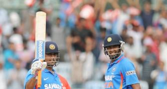 Dhoni happy being a 'punching bag'