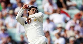 Three late Ajmal wickets halt England