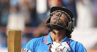 Dhoni rallies India after top-order crumbles