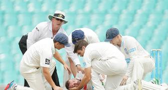 Australia batsman Hughes continues to fight for life