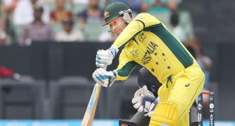 Clarke scores half-century on return as Australia rout UAE