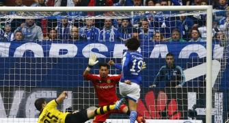 Dortmund twice squander lead in draw at Schalke