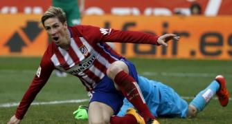 Torres reaches century, Atletico keep pressure on Barca