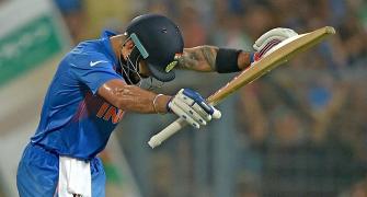 PHOTOS: Kohli bows before 'God of cricket'