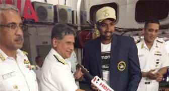 Ashwin enjoys a cup of coffee with naval officials following Vizag win