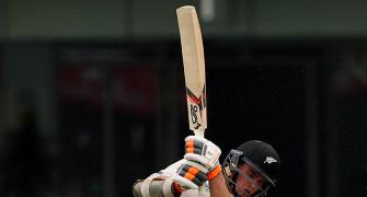 PHOTOS: Rain ends play early but New Zealand in control