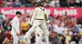 Rain leaves Khawaja stranded on 195, Aus in command