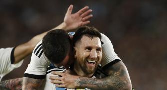 Messi leads Argentina win in 1st game as world champs