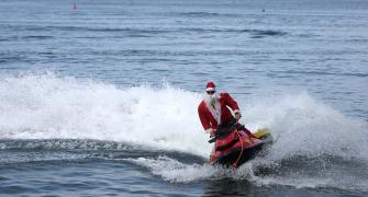 Santa Arrives On A Jet Ski!