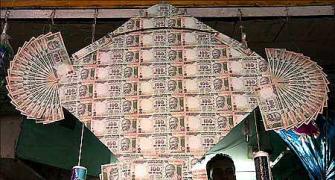 Rupee slips 10 paise to 67.26 on dollar demand