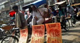Rupee edges up to 62.15 Vs dollar in late morning trade